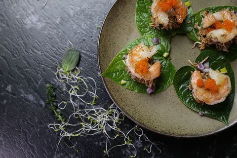 Gourmet seafood appetizers on betel leaves
