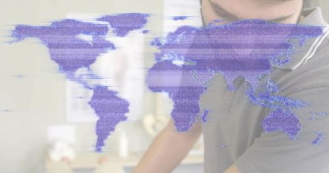 Purple glitch world map overlay on minimal office workspace with man in grey polo