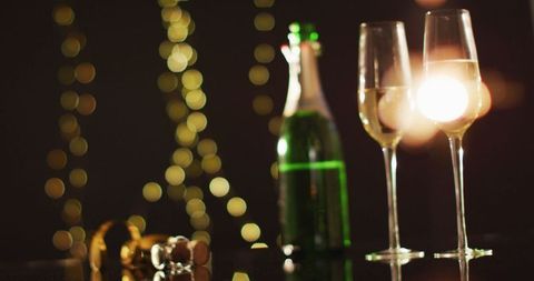 Elegant New Year's Eve Celebration with Champagne and Sparkling Lights