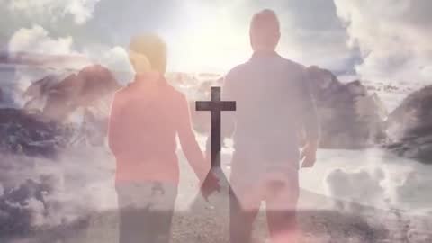 Couple Holding Hands Walking Towards Cross in Mountain Landscape