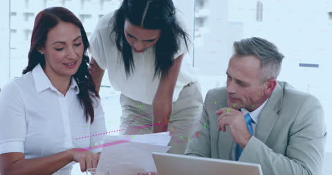 Diverse Business Team Analyzing Financial Data at Office