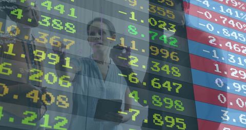 Financial experts analyzing stock market data in synchronized collaboration