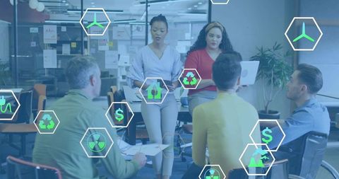 Women leading cross-functional team brainstorming sustainable strategy with green icons