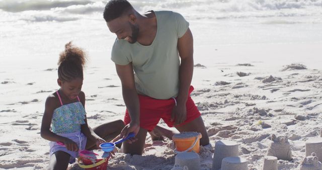 Father and Daughter Building Sandcastles on Beach - Download Free Stock Images Pikwizard.com