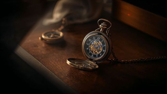Vintage pocket watch displaying intricate skeleton design