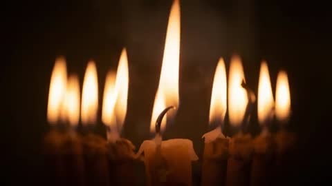 Dancing Candle Flames in Dark Atmospheric Setting