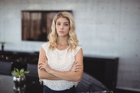 Confident Businesswoman at Modern Office Conference Table