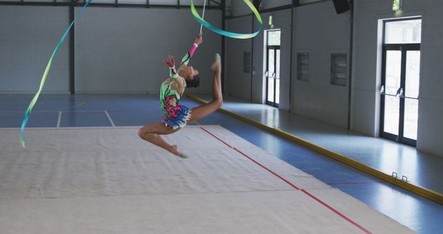 Rhythmic Gymnast Performing Ribbon Routine in Gymnasium - Download Free Stock Images Pikwizard.com