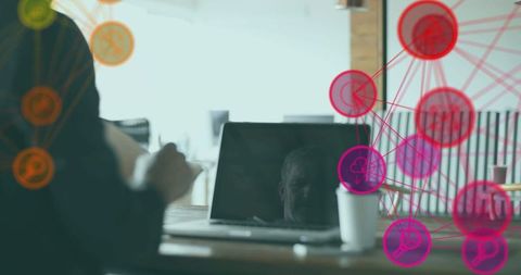 Collaborators gesturing over laptop reflecting colleague with vibrant network nodes overlay