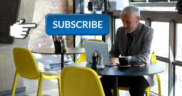 Businessman Using Laptop With Digital Subscribe Button Overlay at Coffee Shop - Download Free Stock Images Pikwizard.com