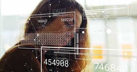 Young Professional Woman Engaging with Futuristic Data Visualization Interface