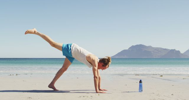 Man Practicing Yoga on the Beach in Morning Sunlight - Download Free Stock Images Pikwizard.com