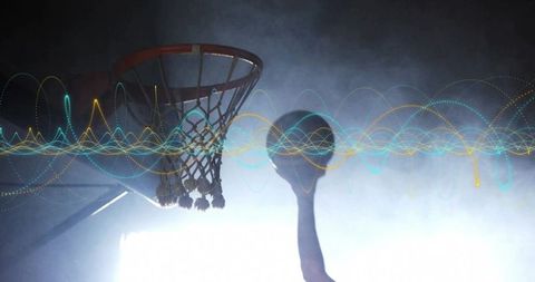 Athletic silhouette dunking near hoop with futuristic waveforms