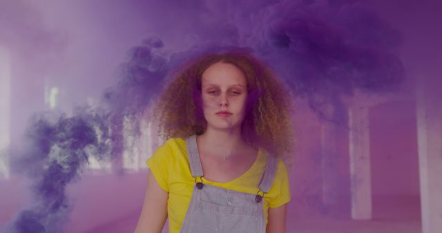Woman with Curly Hair Standing amidst Purple Smoke Indoors - Download Free Stock Images Pikwizard.com