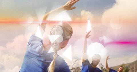 Outdoor group stretching at sunset with lens flare and geometric light overlays