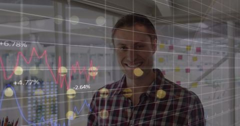 smiling man with financial data overlay in modern office - Download Free Stock Images Pikwizard.com