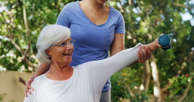 Senior Woman Exercising with Assistance in Outdoor Park - Download Free Stock Images Pikwizard.com