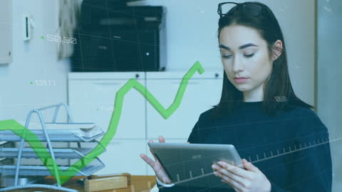 Businesswoman Analyzing Financial Data on Tablet