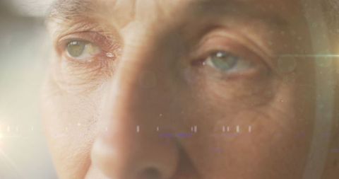 Contemplative senior woman with water reflection