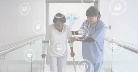 Nurse assisting patient using crutches during mobility training in rehab corridor