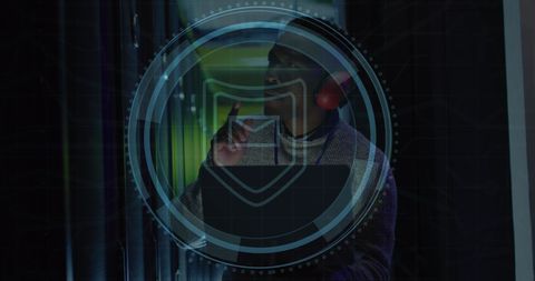 Cybersecurity in data center with engineer using laptop