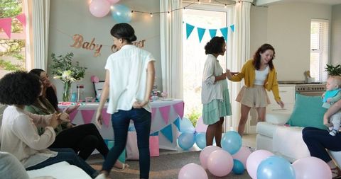 Cheerful Baby Shower Party with Diverse Group of Friends