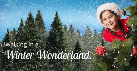 Joyful Child Decorating Christmas Tree in Snowy Wonderland - Download Free Stock Templates Pikwizard.com