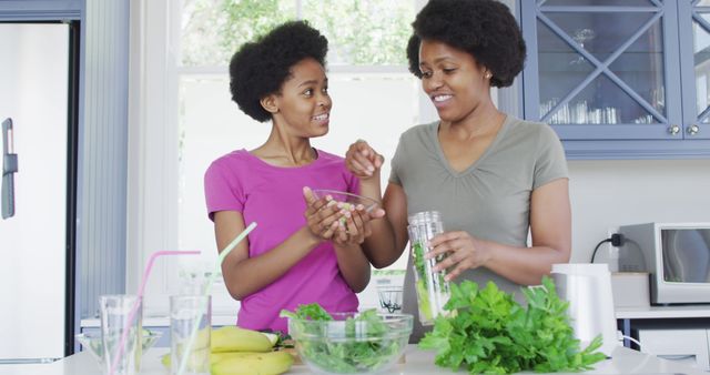 Mother and Daughter Preparing Healthy Smoothie in Kitchen - Download Free Stock Images Pikwizard.com