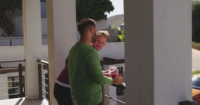 Two Friends Chatting on a Sunny Balcony - Download Free Stock Images Pikwizard.com