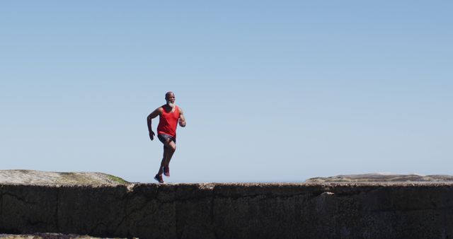 Fit Man Enjoying Outdoor Run on Sunny Day - Download Free Stock Images Pikwizard.com