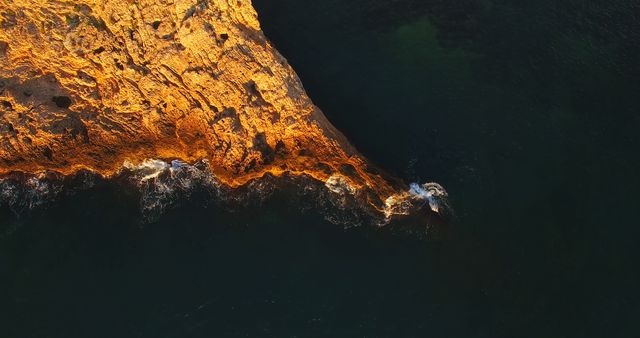 Aerial View of Sunrise on Rocky Coastline with Dark Ocean Waters - Download Free Stock Images Pikwizard.com