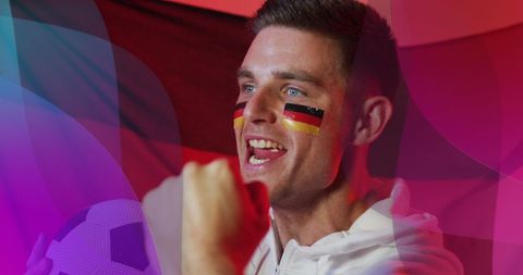 Excited Soccer Fan Celebrating with German Flag Face Paint - Download Free Stock Images Pikwizard.com