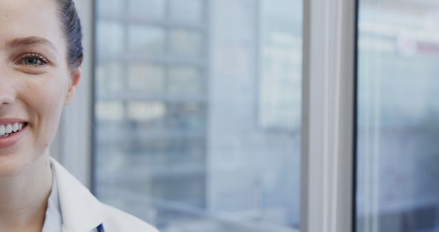 Confident Female Doctor Smiling Brightly in Modern Hospital - Download Free Stock Images Pikwizard.com