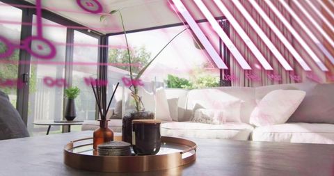 Sunlit minimalist living room featuring decorative tray with frothy coffee and orchid
