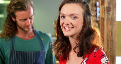 Smiling Couple in Artisan Workshop Highlighting Craft and Creativity