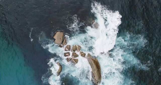 Drone view of clear green ocean water and rocks with copy space - Download Free Stock Photos Pikwizard.com