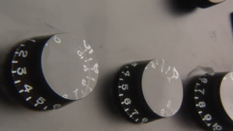 Macro Image of Guitar Volume and Tone Knobs