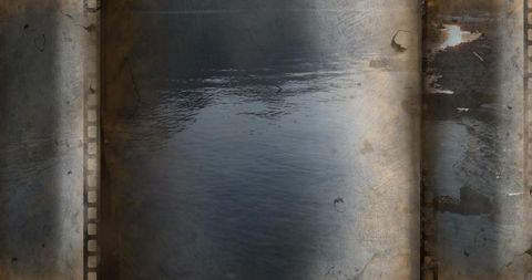Vintage filmstrip water texture with dark ripples, rust patina, grainy grunge film overlay