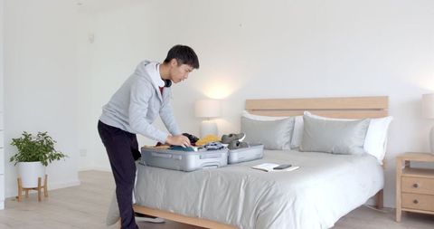 Man packing suitcase for travel say hello to adventure