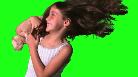 Little Girl Twirling with Joy on Green Screen