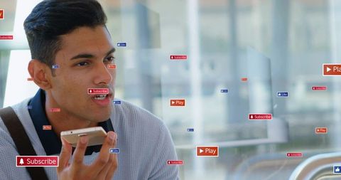 Young man speaking into smartphone with social media overlay and play subscribe like hud