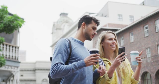 Young Couple Exploring City with Coffee and Smartphone - Download Free Stock Images Pikwizard.com