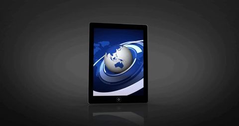 Black tablet showing apac globe with orbit rings on glossy dark studio background