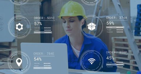 Warehouse logistics worker updating inventory with technology