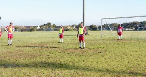 African american male soccer players on field during training session