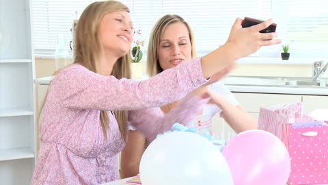 Joyful Friends Posing for Selfie in Bright Kitchen
