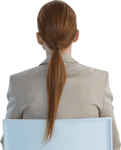 Rear view transparent image of businesswoman with red hair sitting on chair