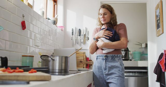 Mother Caring for Baby While Cooking in Small Kitchen - Download Free Stock Images Pikwizard.com