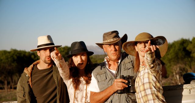 Family on Safari Pointing Towards Wildlife in the Distance - Download Free Stock Images Pikwizard.com