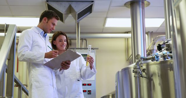 Professionals in lab coats analyzing samples in a state-of-the-art laboratory with advanced equipment. Ideal for use in science, research, laboratory technology, professional teamwork, and educational materials.